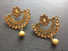 "This Unique pair of Earrings is designed and crafted at PraNiCollectioNs  PraNiCollectioNs is the place for anyone who Is in lookout for a latest trend with an ethnic touch.  We at PraNiCollectioNs offers a great range of Indian Ethnic jewellery's. We are strongly committed to  providing our customers  some uniquely handcrafted products with utmost satisfaction. These jewellery's are made from high quality  material which are Hypoallergenic and are also free from corrosion and rusting. This lis Bohemian Gold Danglers With Stone Work, Bohemian Chandbali Earrings With Stone Work, Bollywood Style Bridal Earrings, Bollywood Style Brass Chandbali Earrings, Gold Bohemian Meenakari Earrings, Gold Meenakari Bohemian Earrings, Bohemian Gold Meenakari Earrings, Bollywood Chandbali Brass Earrings, Gold Bohemian Chandbalis With Stone Work