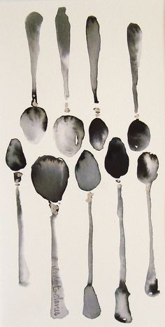 the spoons are lined up in different shapes and sizes, all painted black and white