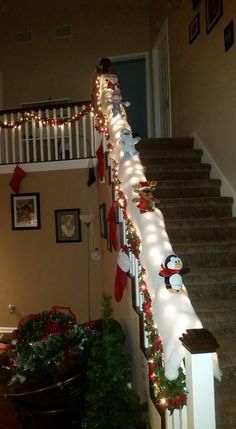 christmas lights are strung up on the stairs