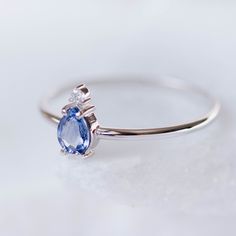 A 14K gold ring with a natural sapphire gemstone pear cut and a diamond brilliant cut in white gold or in yellow gold. A perfect engagement gold ring for women, stacking and delicate that adds glam to every outfit. Sapphire is the birthstone of September. 100% handcrafted with love! D E T A I L S ● Metal: 14K solid white gold, 14K gold, 14K rose gold ● Gemstones: Sapphire, Diamond ● Gemstones weight: Sapphire 0.4ct, Diamond 0.02ct ● Sapphire dimensions: 5.4 x 4.2 mm R I N G ∙ S I Z I N G For Gen Fine Jewelry Pear-shaped Sapphire Ring, Pear-shaped Birthstone Promise Ring, Pear-shaped Sapphire Ring, Fine Jewelry Sapphire Ring With Pear Shape, Pear-shaped Sapphire Gemstone Rings, Pear-shaped Sapphire Ring With Diamond Accents, Teardrop Sapphire Ring In White Gold, Sapphire Pear Shaped Rings For Anniversary, Pear Shaped Sapphire Rings For Anniversary