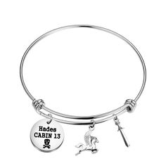 a silver bracelet with a unicorn and the words hadee cabin 13 on it's side