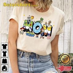 a woman wearing a t - shirt with the word mom in cartoon characters on it