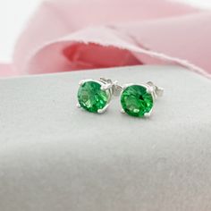 Emerald Green Stud Earrings, perfect for those born in May! The rich green color of the Emerald CZ is complimentary for every season, so these earrings would be a staple in your jewelry collection. Earrings are 4 prong set.D E T A I L S 6mm Round CZ Butterfly Push Back Sterling Silver 11mm Post Green Earrings With Prong Setting As Gift, Green Prong Set Earrings As Gift, Green Prong Setting Earrings For Gift, Classic Green Drop Earrings, Green Jewelry With Prong Setting For Gift, May Birthstone Earrings With Prong Setting In Round Cut, May Birthstone Round Cut Earrings With Prong Setting, May Birthstone Earrings With Prong Setting, Classic Green Round Earrings