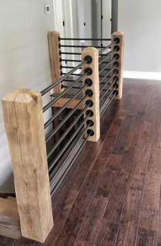 a wood and metal railing in a house