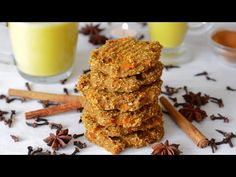 several cookies stacked on top of each other next to cinnamon sticks and star anise