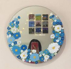 there is a mirror with flowers on it