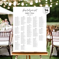 the seating chart for an outdoor wedding is displayed on a easel