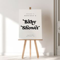 an easel with a baby's shower sign on it