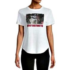 a woman wearing a white t - shirt with the words silly district printed on it