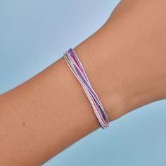 It’s the bracelet that started it all. Each one is handmade, waterproof and totally unique— in fact, the more you wear it, the cooler it looks. Grab yours today to feel the Pura Vida vibes. WaterproofGo surf, snowboard, or even take a shower with them on. Easily AdjustableOne size fits all, easy to slip on and off. 100% waterproof- Wax-coated- Adjustable from approximately 2-5 inches in diameter- Because jewelry products are handcrafted by artisans, dimensions may vary from piece to piece Casual Friendship Wristband For Summer, Casual Beach Wristband Bracelet, Casual Purple Braided Bracelets For Beach, Casual Purple Bracelet For Everyday, Trendy Hypoallergenic Braided Bracelets For Friendship, Casual Everyday Purple Bracelets, Trendy Purple Friendship Bracelets, Adjustable Trendy Wristband For Beach, Adjustable Pink Wristband For Everyday