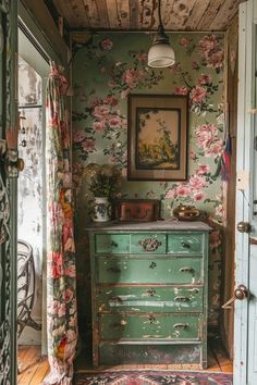 an old dresser in a room with floral wallpaper on the walls and flooring