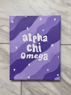 an acrylic sign that says, alpha chi omega on it