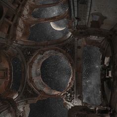 looking up at the ceiling of an old building with stars and moon in the sky