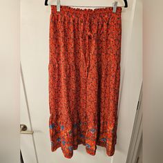 Nwt - Bohemian Zesica Elastic Waist & Drawstring Floral Maxi Skirt - Size L 100% Rayon Length - C. 37" Waist - C. 14.5" Stretches To C. 19.5" Red Maxi Skirt With Elastic Waistband For Beach, Red Long Skirt For Vacation, Red Flowy Maxi Skirt For Festival, Red Skirt With Elastic Waistband For Vacation, Red Relaxed Maxi Skirt For Vacation, Red Hippie Skirt For Vacation, Red Hippie Bottoms For Vacation, Red Bohemian Maxi Skirt For Spring, Relaxed Red Maxi Skirt For Vacation