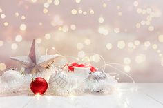 a white table topped with ornaments and lights