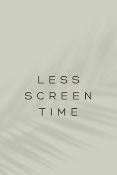 the words less screen time are shown in black on a gray background with palm leaves