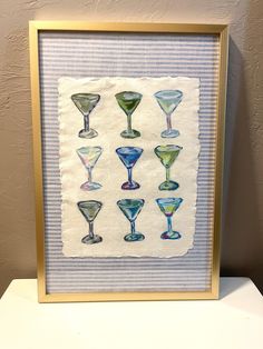 a painting with different colored glasses on it