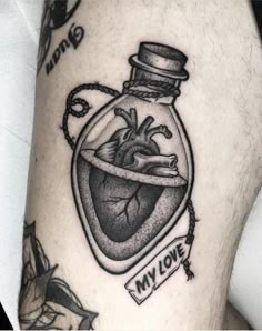 a black and white photo of a heart in a bottle with writing on it that says my love