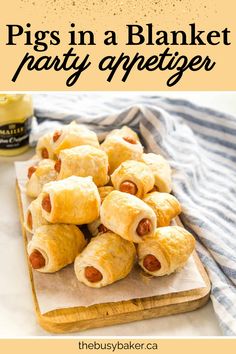 pigs in a blanket party appetizer on a cutting board with text overlay