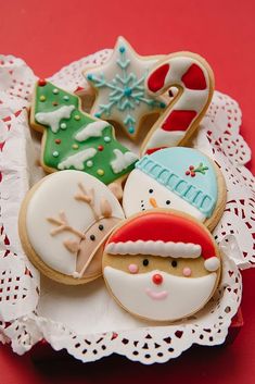 decorated christmas cookies on a lace doily