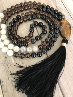 Grounding Strength Mala is part of the Zen Men Design Collection. Be the Foundation There is no better stone than Smokey Quartz for connecting to the earth. It’s one of the most grounding and balancing crystals, with the power to cleanse and purify as well. It is paired with Gold Sheen Obsidian to enhance the grounding qualities. Moonstone can also enhance emotional balance in men, and coupled with the other stones, this mala will set you on a path of being strong and balanced in order to serve Gold Sheen Obsidian, Sheen Obsidian, Removing Negative Energy, The Zen, Emotional Balance, The Foundation, Design Collection, Smokey Quartz, Plexus Products