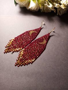 "These dark red gold beaded earrings pair amazingly with any outfit, dressy or casual. They are made of high-quality Czech colored beads with steel . Colors: bdark blue, gold Length: 4.7 inches (12 cm) Width: 1.1 inches (3 cm) Materials: Czech \"Preciosa\" beads Durable synthetic thread medical steel" Elegant Red Beaded Earrings For Festival, Elegant Gold Beaded Earrings For Festival, Elegant Red Earrings For Festival, Elegant Red Beaded Earrings, Red Metal Beaded Drop Earrings, Red Metal Dangle Beaded Earrings, Black And Red Beaded Earrings, Red Beaded Drop Earrings, Pierced, Gold Bead Earrings