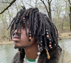 @itsjust.gxbe Long Dreads Ponytail Men, Crystals In Locs Guys, Black Hairstyles Men Long, Hair Beads Men, Locs With Beads Men, Loc Accessories Men, Dreads With Beads Men, Locs Shoulder Length, Different Dread Styles