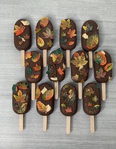 chocolate covered pops with autumn leaves on them