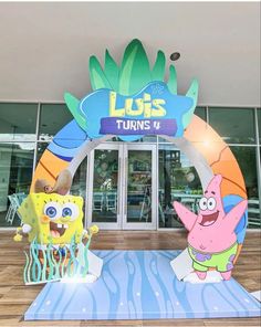 the entrance to an amusement park with spongebob and squidy characters on it