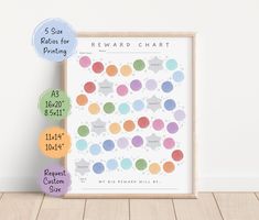 the reward chart is displayed in front of a white wall with three balloons on it