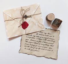 a piece of paper with a wax stamp on it next to a rubber stamper