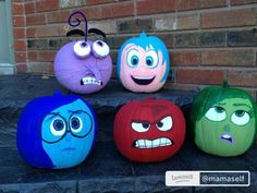 four pumpkins painted to look like cartoon characters