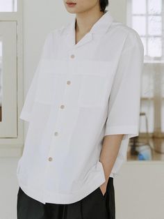 This is a minimal and casual shirt that is made out of high quality cotton 100% fabric. With eco friendly cotton fabric that has a soft touch and natural wood buttons, it is comfortable to wear in a daily life. - Natural wood buttons- Folding design above the pocket- Eco friendly cotton fabric White Collared Short Sleeve Shirt For Everyday, White Short Sleeve Button-up Shirt For Everyday, Everyday White Short Sleeve Button-up Shirt, Minimalist Cotton Summer Shirt, Modern White Cotton Short Sleeve Shirt, Minimalist Summer Cotton Shirt, Modern White Short Sleeve Cotton Shirt, Modern White Shirt For Everyday, White Relaxed Fit Minimalist Shirt