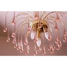 a chandelier with pink glass drops hanging from it