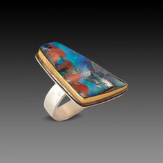 A magical, one of a kind Australian Boulder opal is wrapped in warm 22k gold and accented by a trio of sparkling white diamonds. Sterling silver back and a 6mm hammered band. A truly special and powerful ring, dancing with color and light. Opal measures approximately 1.25 inch x .75 inch. Matte finish. This piece is in stock and ready to be sized to fit, if necessary. Unique Polished Opal Ring For Collectors, Unique Ethiopian Opal Ring, Unique Yellow Gold Opal Ring, Unique Opal Ring For Anniversary, Boulder Opal Ring, Moss Aquamarine, Hammered Band, Australian Boulder Opal, Gold Dots