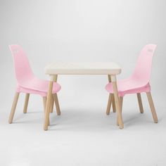 two children's pink chairs and table against a white background, with one child's chair in the foreground