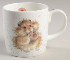 a coffee cup with an image of a hamster on it