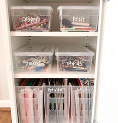 an organized closet with plastic bins filled with crafting supplies and writing on the shelves