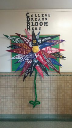 this is an image of a school bathroom decorated with colorful ribbons and paper machs