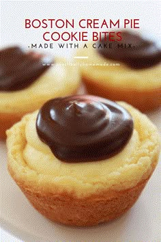 three small cookies with chocolate frosting on top are sitting on a white plate next to each other