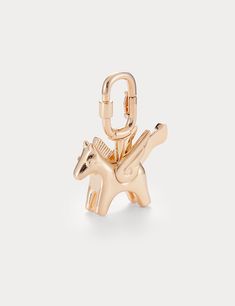 Inspired by the Hermes Cadenas bag charm, the Aelysee Rodeo Pegase Bag Charm is meticulously crafted, blending the distinctive style of the Hermes Rodeo Bag Charm. Exclusively designed for luxurious handbags, this charm pays homage to the timeless Hermes Cadenas in its design. Perfectly complementing series such as the Hermes Kelly and Hermes Birkin, the Aelysee Rodeo Pegase Bag Charm captures the essence of luxury and elegance. Electroplated brass Charm size - 47 x 41mm Total weight 32g One yea Luxury Bag Charm With Keychain, Elegant Everyday Bag Charm With Logo, Luxury Logo Bag Charm As Gift, Luxury Logo Bag Charm For Gift, Luxurious Handbags, Brass Charms, Hermes Birkin, Rodeo, Handbags