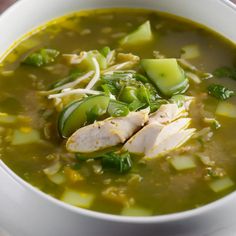 a white bowl filled with soup and vegetables