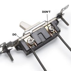 an image of a metal object with screws and wires attached to the top part