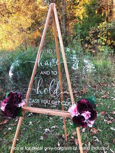 a wooden easel with flowers on it and the words to have and to hold in case you get out