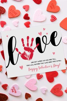 valentine's day card with handprinted hearts and the word love on it