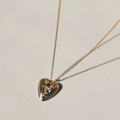 Truly Blessed Jewels - Love is in the Air Necklace Elegant Silver Tarnish-resistant Locket Necklace, Rose Gold Metal Heart Necklace For Anniversary, Elegant Locket Necklace For Valentine's Day Anniversary, Anniversary Rose Gold Heart Necklace, Delicate Heart Pendant Locket Necklace, Elegant Heart Pendant Locket Necklace For Anniversary, Open Heart Metal Jewelry For Wedding, Vintage Metal Necklace With Heart Charm, Elegant Brass Jewelry With Heart Charm