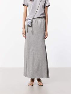 MO&Co. Women's Elasticated Waist Maxi Skirt This flowing maxi skirt is crafted from a soft and breathable cotton blend fabric, making it perfect for warm weather wear. It has a high-waisted design that sits comfortably at the natural waistline, while the A-line silhouette creates a flattering, feminine shape that gently flares out towards the hem. An elasticated waistband ensures a comfortable and flexible fit. Pair this skirt with a tucked-in T-shirt for a chic and put-together look. Features :