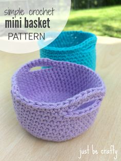 three crocheted baskets sitting on top of a wooden table