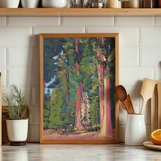 a painting is hanging on the wall above a kitchen counter with wooden utensils