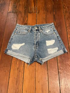 Sweet pair of vintage cut off jeans for sale. These shorts are in great vintage condition and have an awesome distressed look with fraying and sewn cuffs. They look even better in person. Check measurements for proper fit  Approx Measurements: Waist- 13" Hip- 16" Inseam- 2" Rise- 10.5" Grunge Mid-rise Jean Shorts With Frayed Hem, Grunge Ripped Jean Shorts, Grunge High Rise Distressed Shorts, Grunge Ripped Cutoff Shorts, Grunge High-rise Jean Shorts With Frayed Hem, Ripped Cotton Jean Shorts, Grunge Ripped Cutoff Jean Shorts, Grunge Cutoff Denim Jean Shorts, Grunge Cutoff Denim Shorts